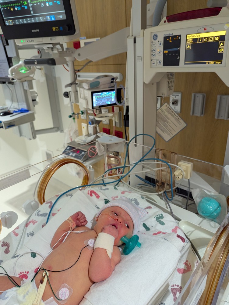 a baby, Vienna Reichart, in the NICU hospital bed
