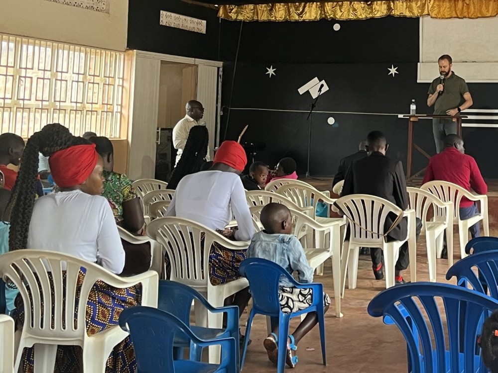 an American man presenting to an African audience