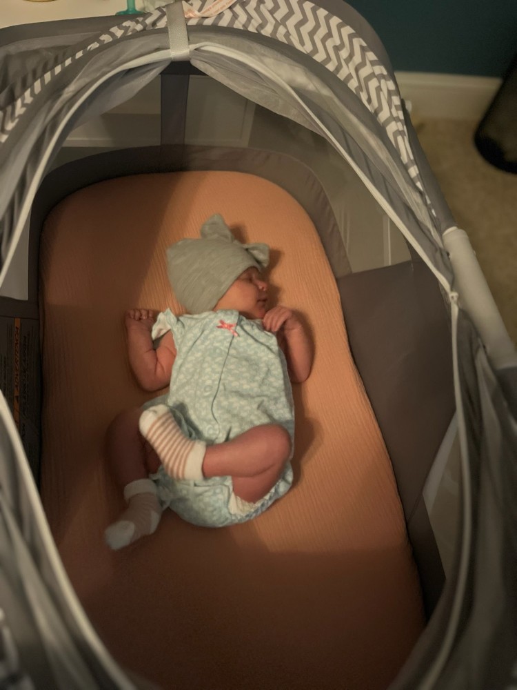 Vienna Reichart in a bassinet